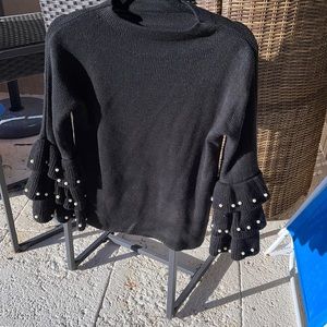 Black sweater with beautiful pearl sleeves